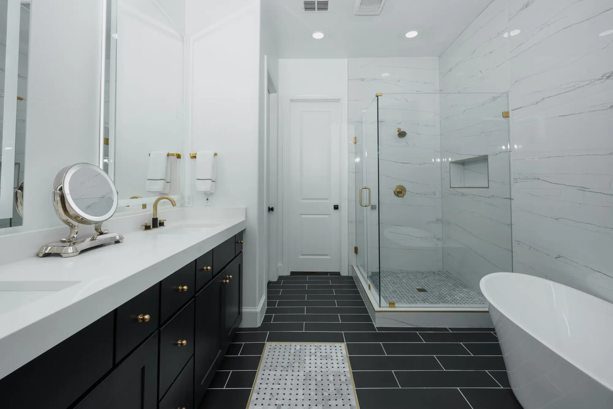 Primary bathroom with freestanding tub and marble shower